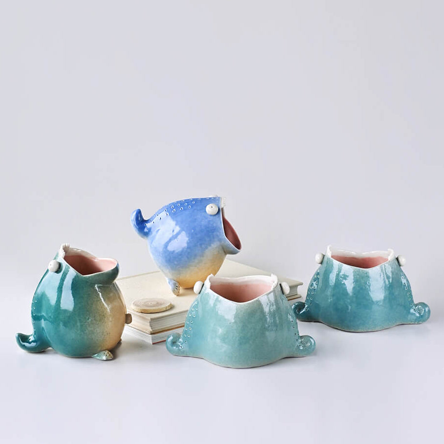 Small ceramic holder used as planter for succulents