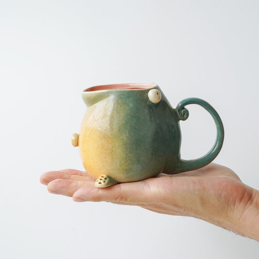 Handmade ceramic mug for coffee with unique design